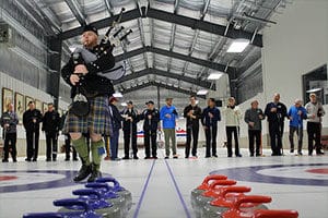 Photo of bagpiper leading opening ceremony at the Norfolk, Connecticut, curling club.