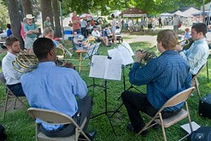 Photo of brass quintet playing at Norfolk, Connecticut, farmers market.
