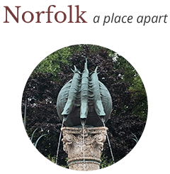 Image of 3 bronze fishes spouting water, used as an element town of Norfolk site graphics