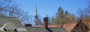 Photo of church spire above roofs, Norfolk, Connecticut.