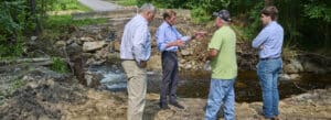 Photo of officials assessing flood damage, Norfolk, Connecticut.
