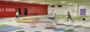 Photo of people playing pickleball in Botelle School gym, Norfolk, Connecticut.