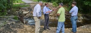 Photo of town officials discussing road damage, Norfolk, Connecticut.