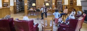 Photo of an accordion player performing in the Norfolk (Connecticut) library.