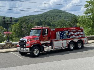Photo of a Norfolk (Connecticut) Volunteer Fire Department truck parked on Station Place.