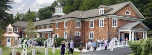 Photo of the exterior of the Music Shed with people going in, Norfolk, Connecticut.