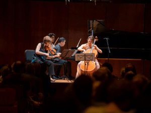 Photo of string quartet performing at the Norfolk Chamber Music Festival.