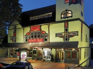 Photo of the exterior of Infinity Hall, Norfolk, at night during a concert.