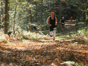 Photo of three trail runners in the Land Trust's Haystack Challenge race, Norfolk, Connecticut.
