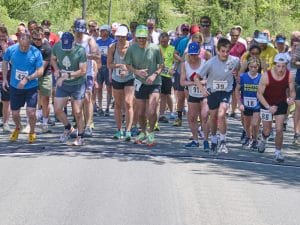 Photo of runners at the start line of Norfolk, Connecticut's Memorial Day road race.