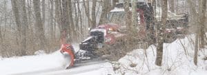 Photo of a town snowplow clearing the road in Norfolk, Connecticut
