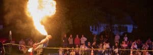 Photo of a fire-swallower performing at Friday Night on the Green, Norfolk, Connecticut